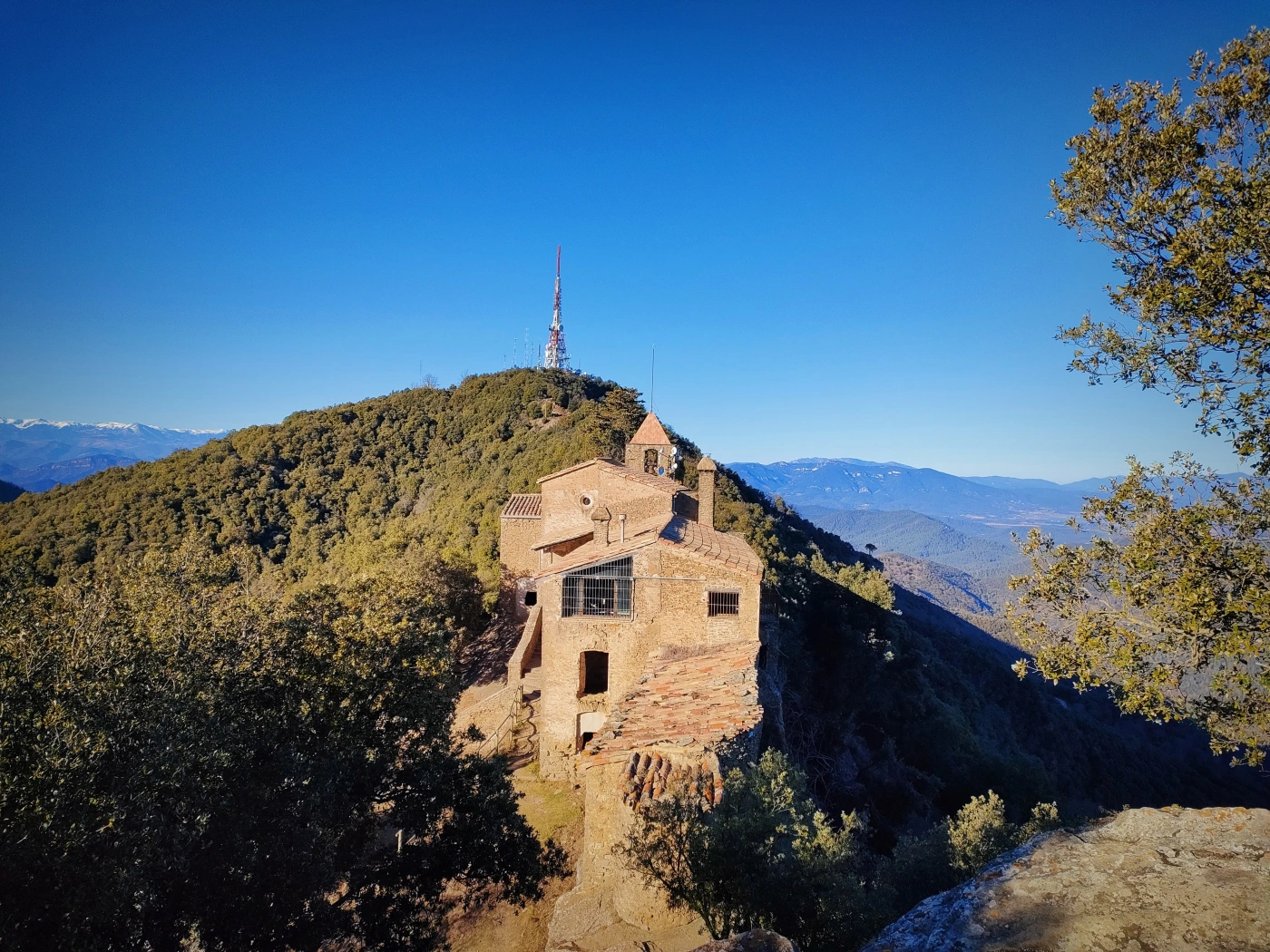 panoramic view of the sanctuary of Rocacorba and the Pyrenees in the distance