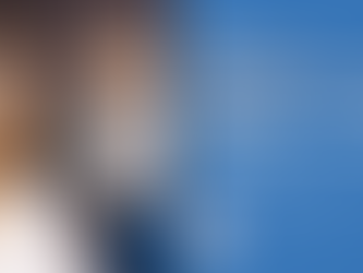 Image of a woman talking to a therapist about childhood trauma and how it is currently affecting her.