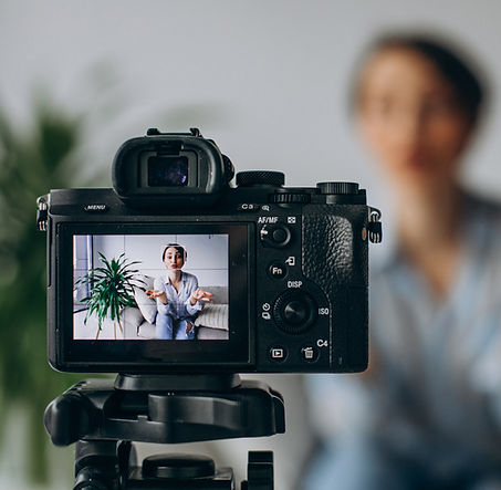 young-woman-blogger-recording-video-camera.jpg