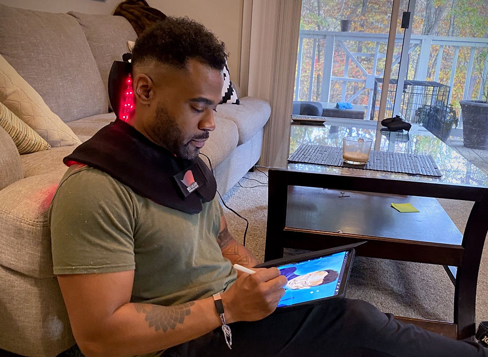 man using red light therapy at home