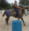 horse with kinesiology tape on while barrel racing to prevent injuries