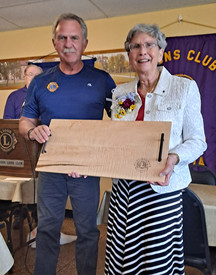 PDG Kevin Reich saying farewell to Lion Jeannine Windels of the Crookston Lions Club, 2021.