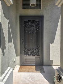 A single security door in the Alta Vista design with
Oil Rubbed Bronze powder coat. This security door is upgraded with Black sun screen,
Box kick plate, faux eyebrow arch, custom pull #5, and 4" outer frame.