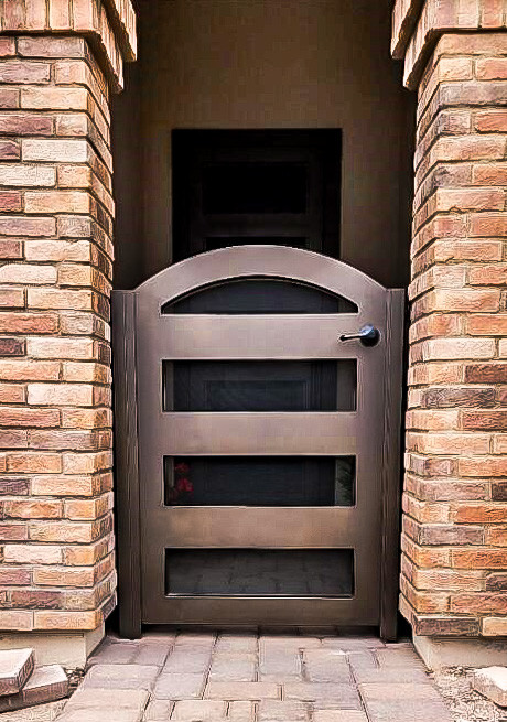Custom iron courtyard enclosure designed to enhance curb appeal and secure a residential entryway by Allied Iron.