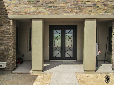 If you’re a homeowner in Metro Phoenix looking for a custom iron entry door that elevates curb appeal while maximizing security, this is exactly what you want to see.
