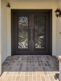 A double square entry door with Oil Rubbed Bronze powder coat, Aquatex glass pattern, and custom pull #5.