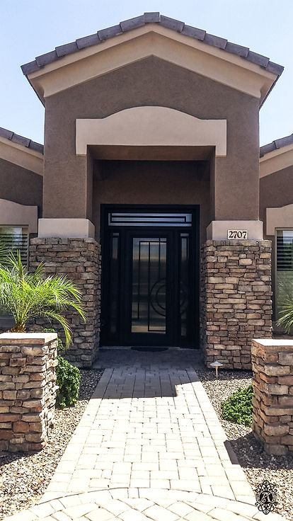 Custom iron entry door installed on a luxury Phoenix home