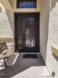 A single square & side light entry door with Oil Rubbed Bronze powder coat, Flash (discontinued) glass pattern, and custom pull #5.