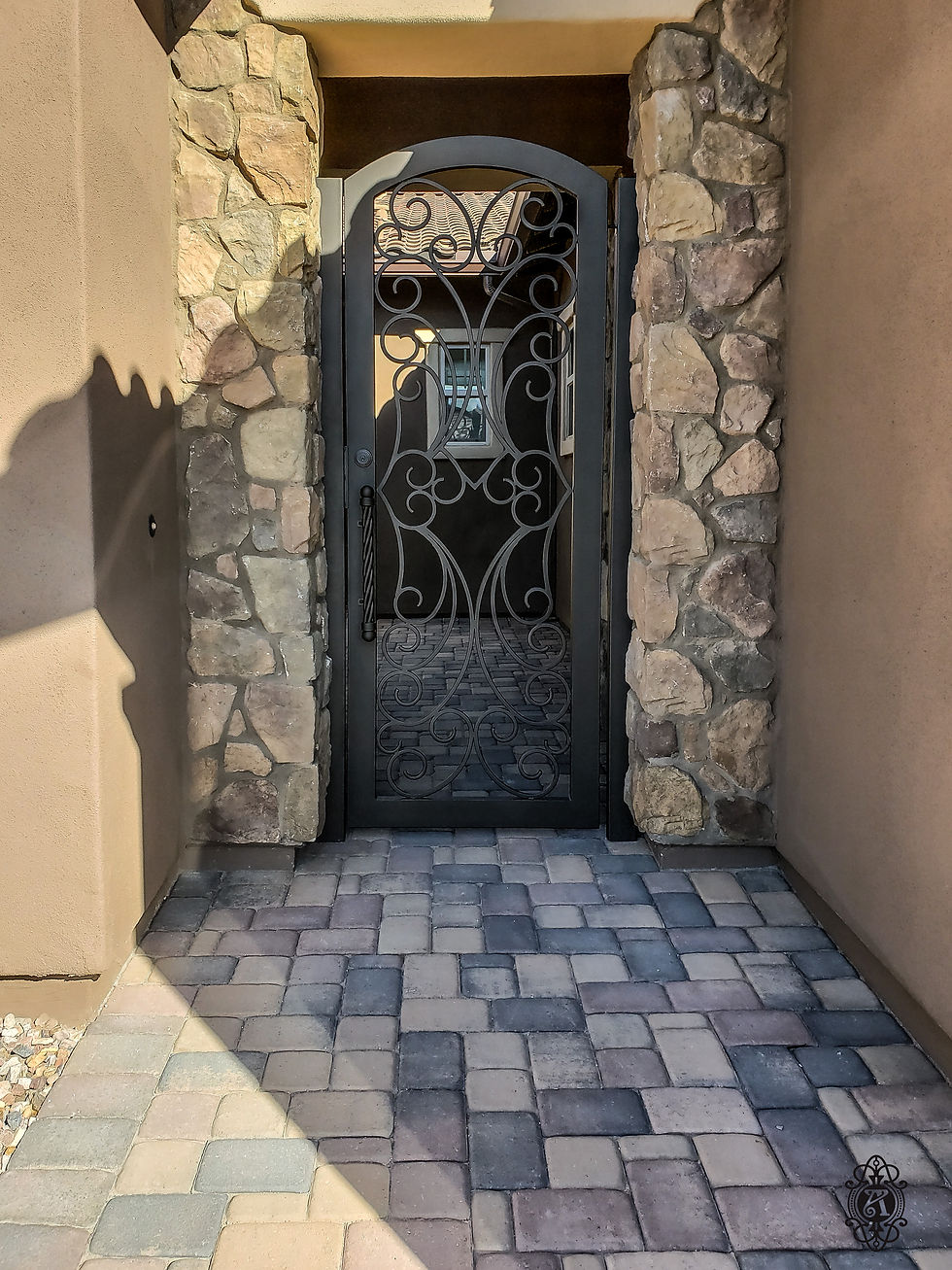 A custom iron courtyard enclosure from Allied Iron.