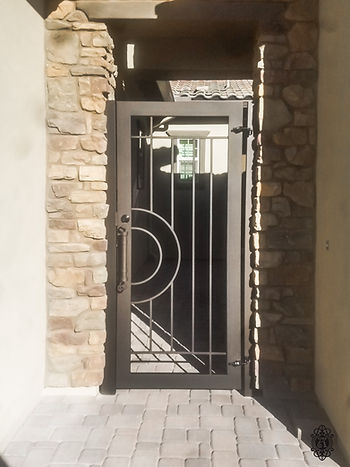A custom iron courtyard enclosure from Allied Iron.