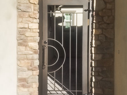 A custom iron courtyard enclosure from Allied Iron.