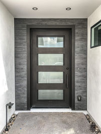 A single square entry door with Brown powder coat, Frosted glass and custom pull #8.
