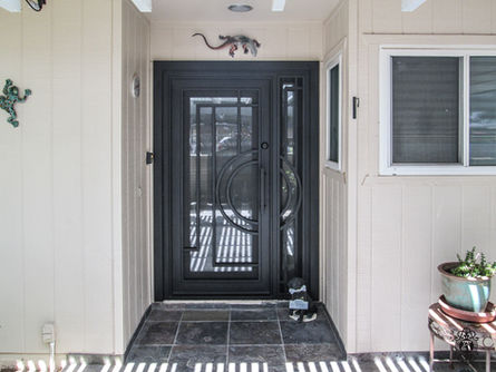 A custom iron entry door in the Nix design