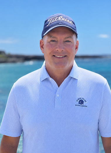 Gary Bush, founder of Bogey Free Golf Travel and Golf Travel Concierge, standing near the ocean.