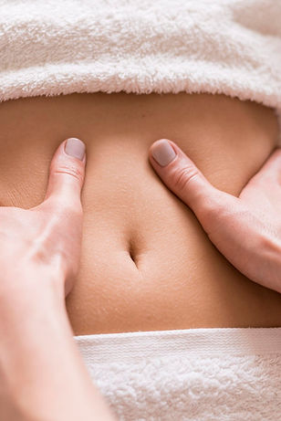 close-up-abdomen-massage-concept-scaled-644585530.jpg