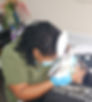 picture of quitta treating a client.jpg