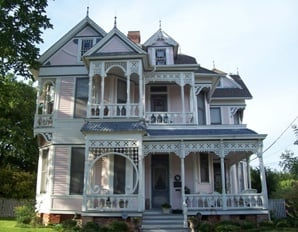 Victorian historic home featuring ornate woodwork and balconies