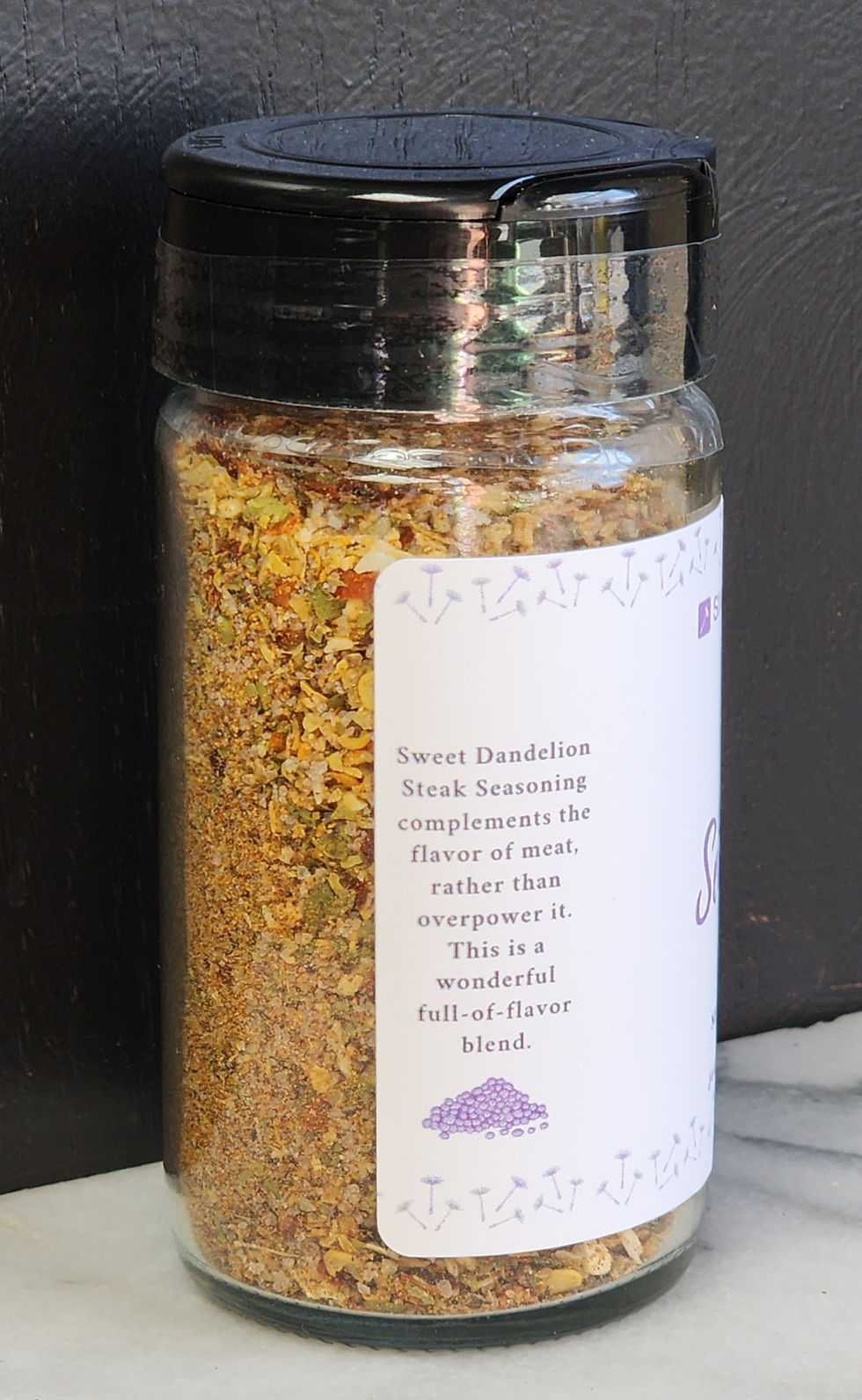Thumbnail: Jar of Sweet Dandelion Steak Seasoning-description panel with black lid