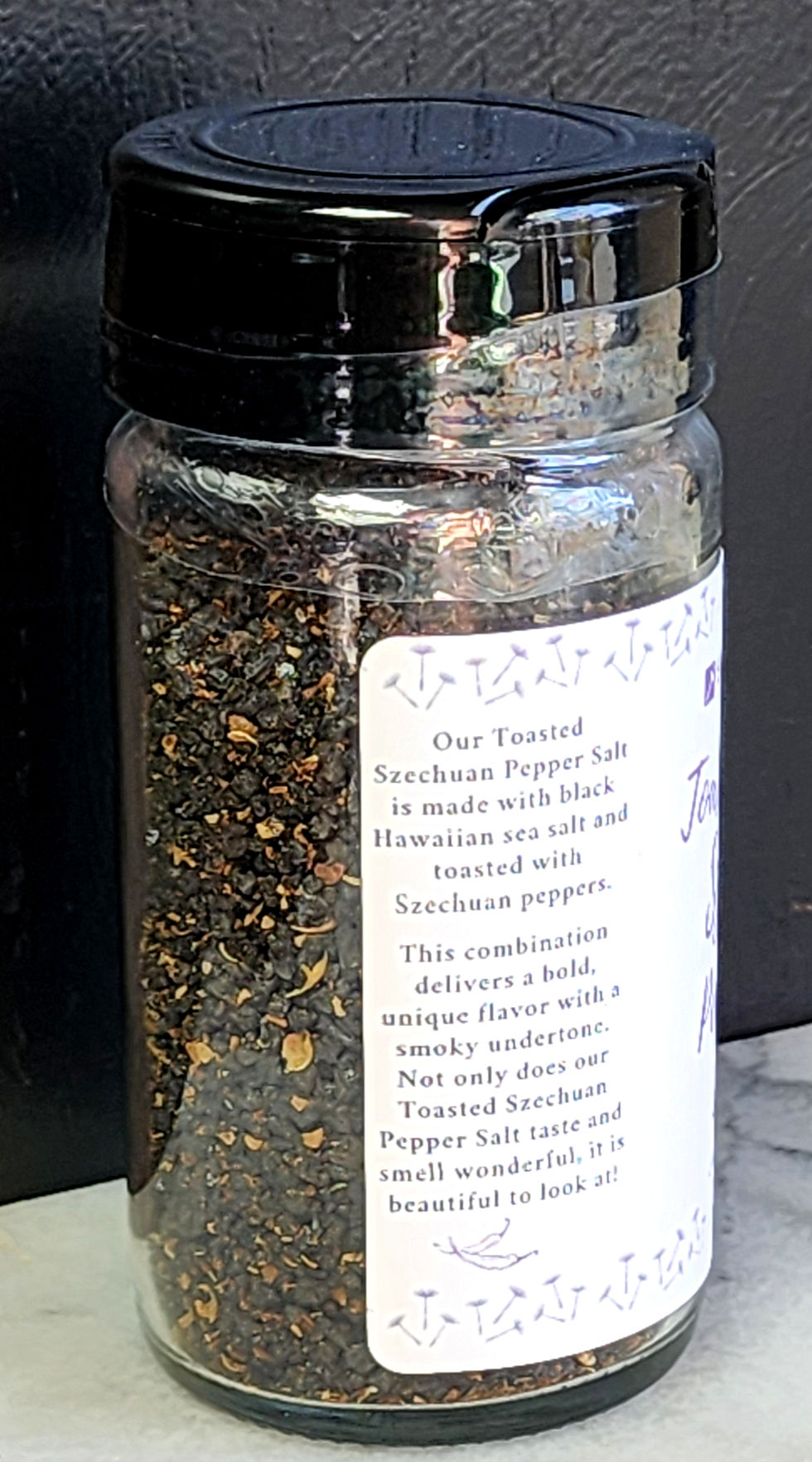 Thumbnail: Jar of Sweet Dandelion Toasted Szechuan Pepper Salt-description panel with black lid