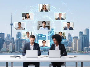 two professionals work on laptops at a desk with a city skyline backdrop. above them, virtual meeting participants are connected in a circular digital interface for remote staffing in canada.