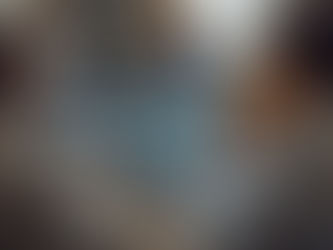 a group of four people are collaborating at a wooden table with laptops. they seem focused and engaged, working in a bright, casual office space on virtual staffing explained.