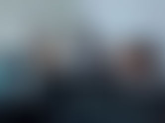 a group of five diverse professionals in an office setting, focused intently on computer screens. the atmosphere is collaborative and engaged for staffing agency in canada.