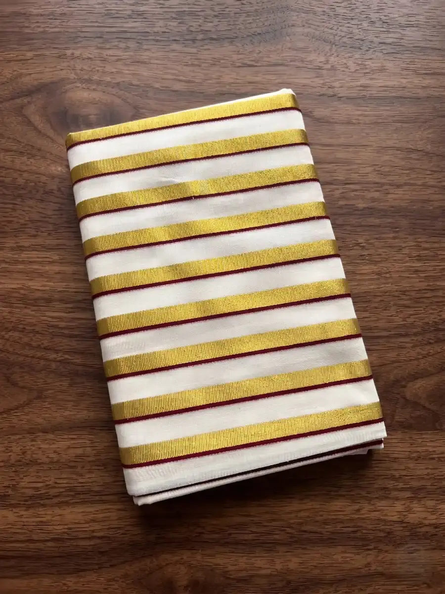 Thumbnail: Maroon Golden Stripe Kasavu Cotton Saree Folded View