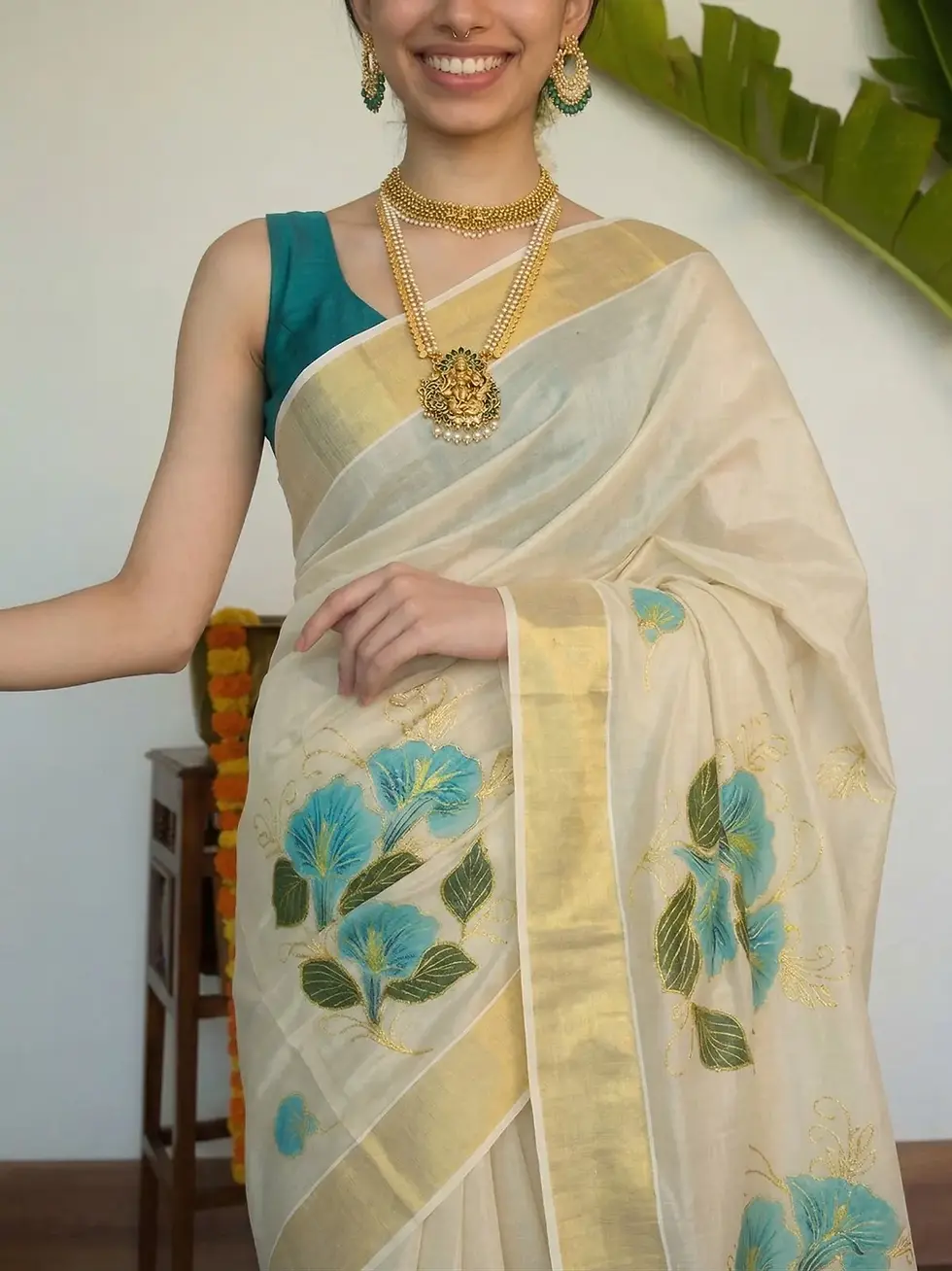 Traditional Turquoise Floral Golden Kasavu Tissue Saree Close up View