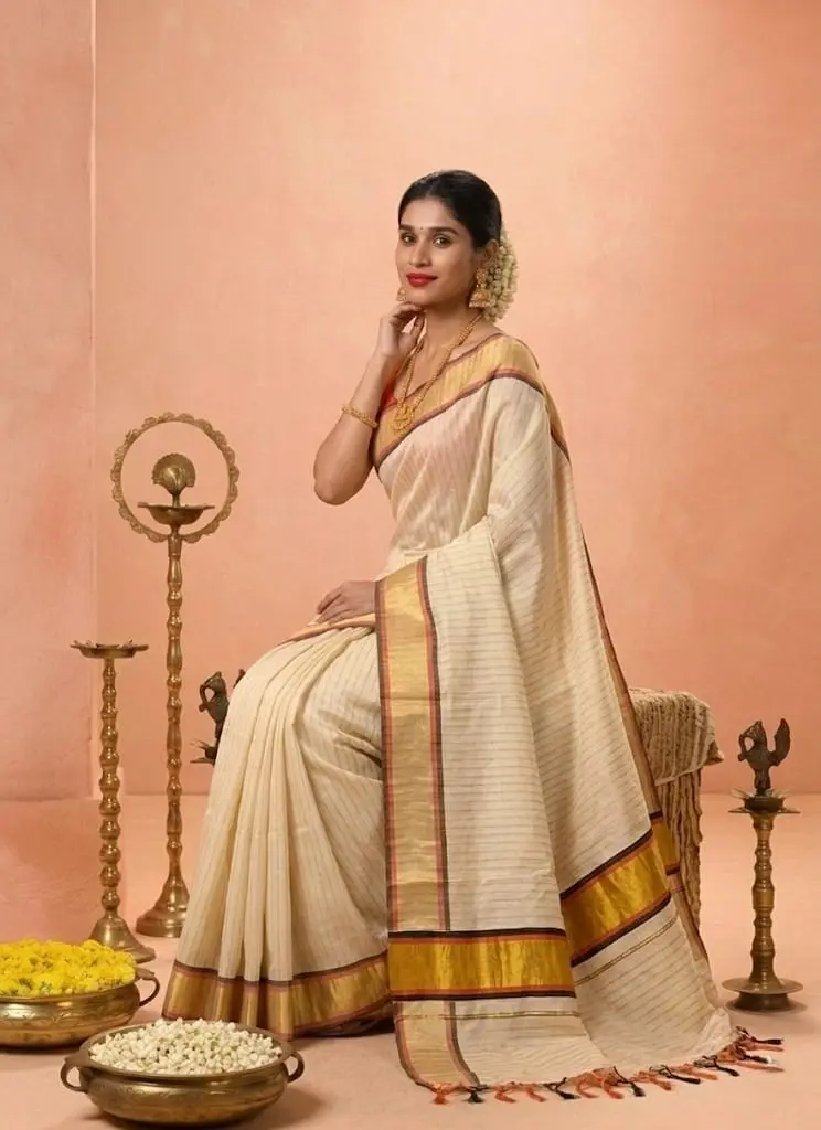 Orange & Black Golden Kasavu Stripe Tussel Tissue Saree Sitting View