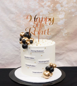 1 Tier Smooth Buttercream with Black & Gold Balls