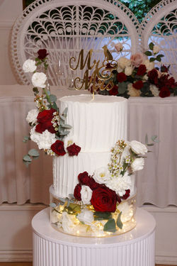 2 Tier Verticle Lined Buttercream with Red & White Flowers