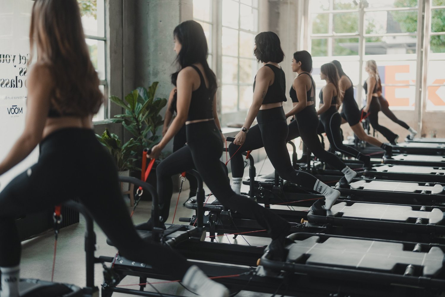 Members mid-class on the Megaformer at MOOV's South Lake Union studio