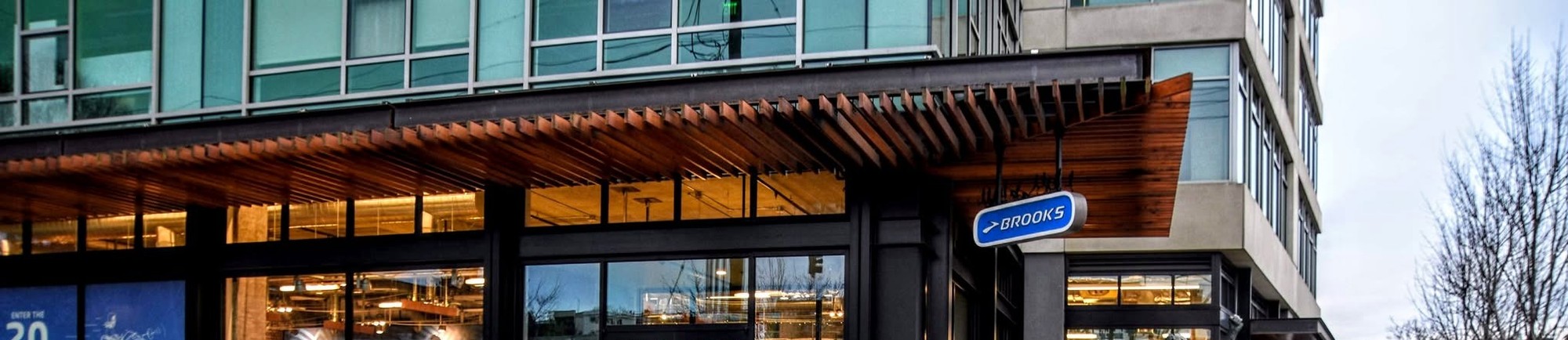 <h2>Three Local Brands, Three Fall Dates, One Fremont Front Door</h2>
<p>Brooks Running's flagship store occupies the ground floor of the company's own Fremont headquarters, right on the Burke-Gilman Trail, and this fall it is hosting more than a standing group jog. Trailhead, at 3400 Stone Way N, carries a full calendar of dated runs and community events running between now and Kraken hockey season, each one tied to a specific date, a specific meeting point, and usually a neighbor business filling in the after-party. Tuesday and Thursday runs still anchor the week the way they always have. Three dates matter most this fall. A Seattle company sits behind all of it, headquartered in Fremont since long before the neighborhood got trendy, and the fall lineup leans into that fact instead of hiding it. A pop-up run tied to a local water-bottle brand, a cookout with the Japanese outdoor outfitter that just moved in next door, and packet pickup for the city's newest hockey team's 5K all route through the same front door on Stone Way. None of it requires a plane ticket. Showing up on the right day is the only ask.</p>
<h2>The Standing Order: Tuesday and Thursday Runs</h2>
<p>Group runs have gone out from Trailhead twice a week for years, long enough that regulars stopped treating them as an event and started treating them as a standing appointment. Tuesdays at 6 p.m. split into 6-mile and 3-mile routes, Thursdays at 6 p.m. split into 5-mile and 3-mile routes, both departing straight from the store's front door on Stone Way. Pacers cover a wide enough range that a first 5K and a marathon taper can start from the same sidewalk without either one feeling out of place. What happens after is not on Brooks' own event page. Fremont regulars have kept a tradition alive for years, crossing Stone Way afterward to Fremont Brewing for beer, cider, or something without alcohol in it. Store hours run a little looser than a headquarters address might suggest, roughly 10 to 7 most days and 10 to 6 on Sunday, worth a call ahead before a special trip.</p>
<h2>August 22: A Morning Run With MiiR</h2>
<p>First on the fall calendar is Saturday, August 22, when Brooks teams up with MiiR for a Morning Run Club between 8 and 10 a.m. It starts at Trailhead as a three-mile run and walk, finishing a few doors down at MiiR's pop-up shop inside Stone Way Auto, 3621 Stone Way N, open only through August 23, so this lands close to the pop-up's last weekend. Nobody has to belong to a run club or own a MiiR bottle to show up. Seawolf Bakers is supplying the pastries at the finish, Tailwind Nutrition is handling hydration, and there are raffles and MiiR swag for anyone who sticks around after. No price is listed. In Seattle, that usually means one thing: free, first come, first served.</p>
<h2>September 10: A Run and Cookout With Snow Peak</h2>
<p>Snow Peak, the Japanese outdoor gear brand that opened a Fremont hub down the block this spring, gets its turn on September 10. Its own event listing calls this a partnership with our neighbor, and the phrase is accurate almost to the foot. This run keeps a familiar shape: 5-mile and 3-mile routes with pacers, out from Trailhead between 6 and 8 p.m. Snow Peak supplies refreshments before the group heads out, then grills after everyone gets back. What started as a quick weeknight loop turns into something closer to a block party. Pricing is not listed. Free is the safe assumption here too.</p>
<h2>October 3: Packet Pickup for the Kraken 5K</h2>
<p>October brings the Seattle Kraken 5K to Green Lake Park on Saturday, October 3, presented by Virginia Mason Franciscan Health, and Trailhead is where the race-day logistics start. Packet pickup runs Thursday, October 1, from 3 to 7 p.m., right back at 3400 Stone Way N. Brooks signed on as the team's off-ice performance partner, and goalie Joey Daccord wears the brand as an ambassador off the ice, so a 5K built around the team fits a relationship that already existed. Swinging through Trailhead two days early beats standing in a race-morning line at Green Lake.</p>
<h2>A Hometown Brand That Shows Up Everywhere</h2>
<p>None of this fall calendar happens at T-Mobile Park, but Brooks' name is there too, sewn into a piece of Seattle sports culture that has nothing to do with running shoes and everything to do with a salmon. The Mariners' Salmon Run mascot race, sponsored by Brooks, runs at home games through the end of the regular season. The salmon has a name: Humpy, and after a moment during last year's playoff run, Humpy became something closer to a minor local celebrity than a mascot. Kids Run the Bases and a Rally Shoe Cam round out the sponsorship, small touches that add up fast. Watching any of it costs nothing and requires no race bib. Three-mile Saturday jogs and a mascot racing the bases are not the same kind of event, but they come from the same marketing budget. One Fremont running shoe company has wired itself into baseball season, hockey season, and a two-block stretch of Stone Way all at once.</p>