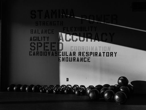 Kettlebells and barbells set up in a strength and conditioning studio in Belltown, Seattle