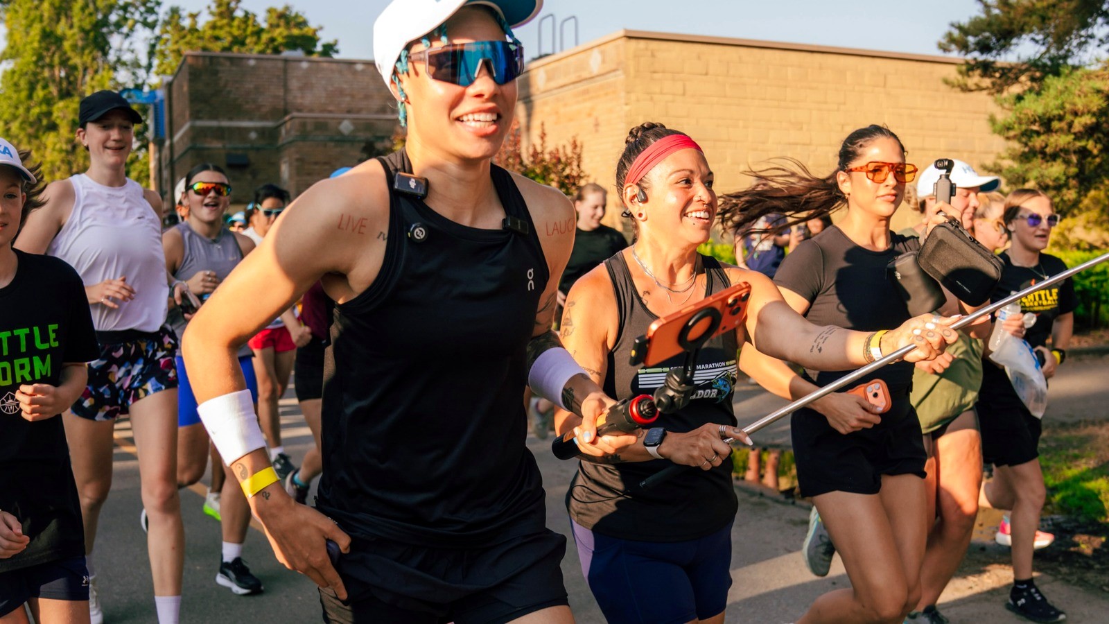 <h2>From 25 Runners to Nearly 400 in a Fortnight</h2>
<p>Natisha Hiedeman plays guard for the Seattle Storm. In August 2026 she started a run club called Run Budz, announcing it first on her Twitch stream. The first run drew about 25 people. The second run, at Green Lake Park, drew nearly 400. That jump landed within two weeks of the first announcement. Run Budz now meets Tuesdays for a 2.8-mile loop of Green Lake, gathering near the Seattle Public Theater before the group sets off around the water. Updates go out on Instagram at @run.budz and on Strava.</p>
<h2>From a Twitch Stream to a Standing Tuesday</h2>
<p>Run Budz began on a livestream. Hiedeman announced it on Twitch, the platform where she already streams regularly, and the name nods to StudBudz, the viral streaming duo she runs with Courtney Williams. The naming is worth pausing on, because it makes the run club a spinoff of a streaming brand rather than of a basketball career. The audience was already assembled before there was anything to attend. One announcement converted a share of it into people standing at a lake on a Tuesday evening, which is a shorter distance from screen to sidewalk than most fitness marketing manages with a budget behind it.</p>
<h2>The Loop Green Lake Already Knew</h2>
<p>Green Lake did not need a new run club to matter to Seattle runners. The park hosts the Seattle Kraken 5K on October 3 and the Greenlake 5K and Wellness Festival on October 24, three weeks apart, and both use the same water's-edge path as their staging ground each fall. Both also cost money and run on deadlines. The Kraken 5K is $35 for adults and $15 for kids twelve and under, with the price rising after August 31. The Greenlake 5K holds a $45 rate only through August 30 before jumping to $55. What Run Budz added was frequency. A race comes once a year and closes registration months ahead of itself. The Tuesday loop happens every week, costs nothing, and requires no entry at all.</p>
<h2>"I'm Like a Connector"</h2>
<p>Hiedeman has been direct about what she is building. "I feel like, in a sense, I'm like a connector," she told FOX 13 Seattle. "So to be able to bring all these people together and connect people... that's what my biggest goal in life really is." Connector is a notable word choice from a professional athlete, who could reasonably have said coach or captain and had either fit. It describes a role rather than a training program, and it matches how she has run the thing since: the route is the occasion, the crowd is the point.</p>
<h2>Showing Up Is the Whole Bar</h2>
<p>The second quote sets the entry requirement lower still. "Hey, I would just say showing up... that's what matters," Hiedeman said. "I feel like you don't gotta run, but just come support. You can walk, you can scooter, you can do whatever... That's the first step." No pace, no distance, no expectation of finishing the 2.8 miles. That is a strikingly low bar for a club organized around someone whose profession runs on the opposite terms, where showing up is the minimum and performing is the job.</p>
<h2>Built Without a Franchise</h2>
<p>Seattle already has the other model to compare against. Cooldown Running started with a handful of friends in Denver in fall 2022 and now operates as a national franchise, listing chapters in roughly 17 to 21 cities depending on which of its own channels are counted. Its Seattle chapter meets Wednesdays at 6:30pm in South Lake Union, led by a five-person team, and calls itself "a social club disguised as a run club." The company has also collected the trappings that come with scale, including a retail partnership with Fleet Feet announced in April 2026 and a separate deal with Altra Running. Seattle was not among the four cities Fleet Feet named for that partnership's launch. So the franchise with national retail deals skipped this market in its first round, and the club with no deals at all drew nearly 400 people to a lake here in a fortnight. Run Budz went from one Twitch announcement to that crowd with no apparatus behind it, in a single city, on a single loop, organized by one person who already had an audience.</p>
<h2>A Hard Season, Off the Scoreboard</h2>
<p>The Storm's 2026 season was rough by any measure. Seattle finished 6-27 and was eliminated from playoff contention after a year that included two separate double-digit losing streaks, the kind of record that usually keeps a roster out of the local conversation entirely once the standings settle. Hiedeman built Run Budz during that same season. A guard on a team with almost nothing to show for its record started a Tuesday gathering that outgrew itself in a fortnight, on a loop in her own city, open to anyone willing to walk it. The day and the route go out through Instagram at @run.budz and on Strava. The standings say one thing about the Storm's year. The Tuesday crowd at Green Lake says something else about the guard who built it anyway.</p>
<p><em>Photo: Run Budz (@run.budz), from the club's Tuesday run at Green Lake.</em></p>