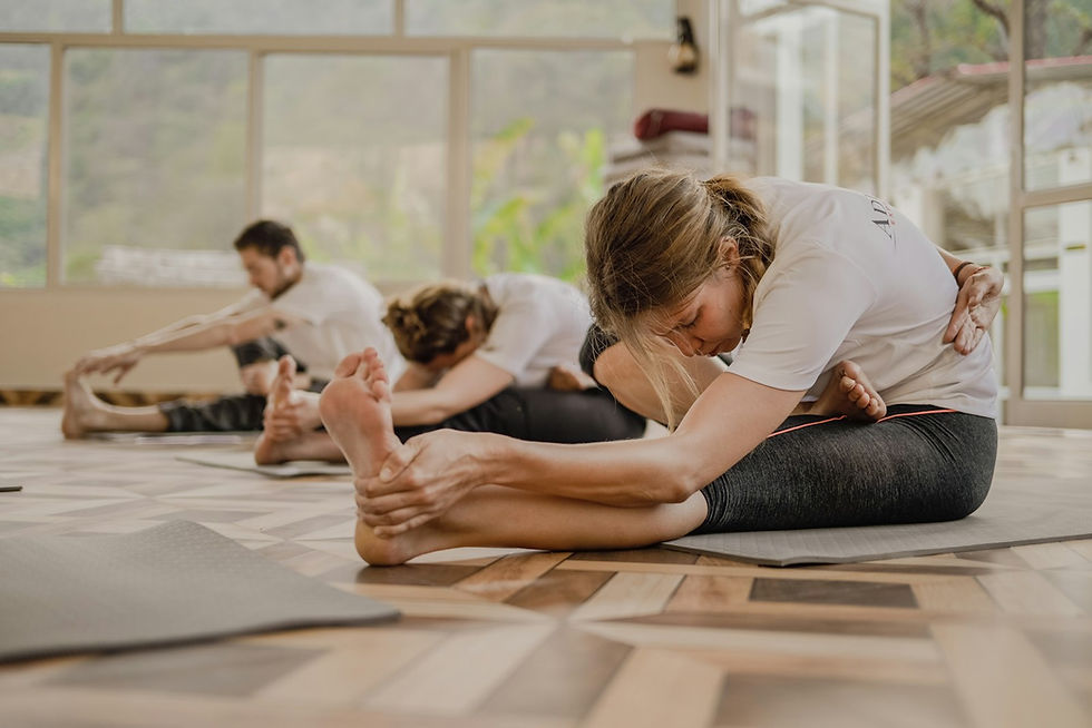 Students flowing through a heated power vinyasa yoga class in a Seattle studio