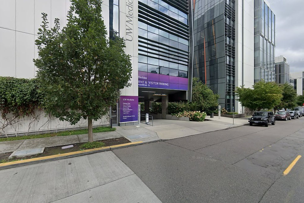 Building F street-level entrance with purple 'UW Medicine Patient & Visitor Parking' banner and directory sign