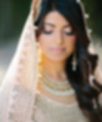 bride with eyes closed and orange tint wedding gown on