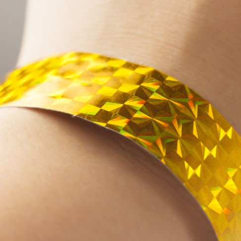 Standard paper wristband design with yellow holographic diamond pattern.