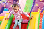 Girl Playing in Bouncy Castle