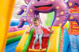 Girl Playing in Bouncy Castle