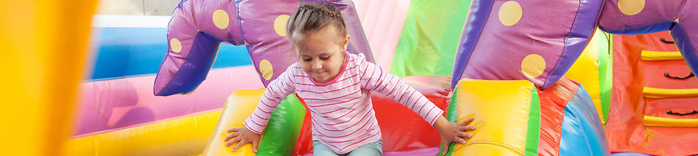 Girl Playing in Bouncy Castle