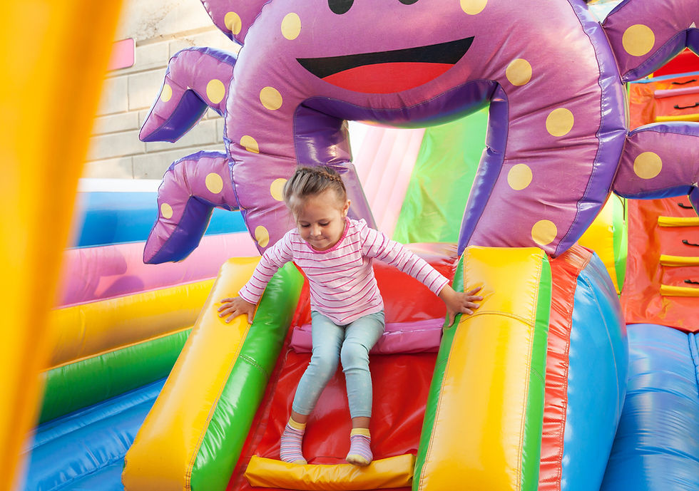 Girl Playing in Bouncy Castle