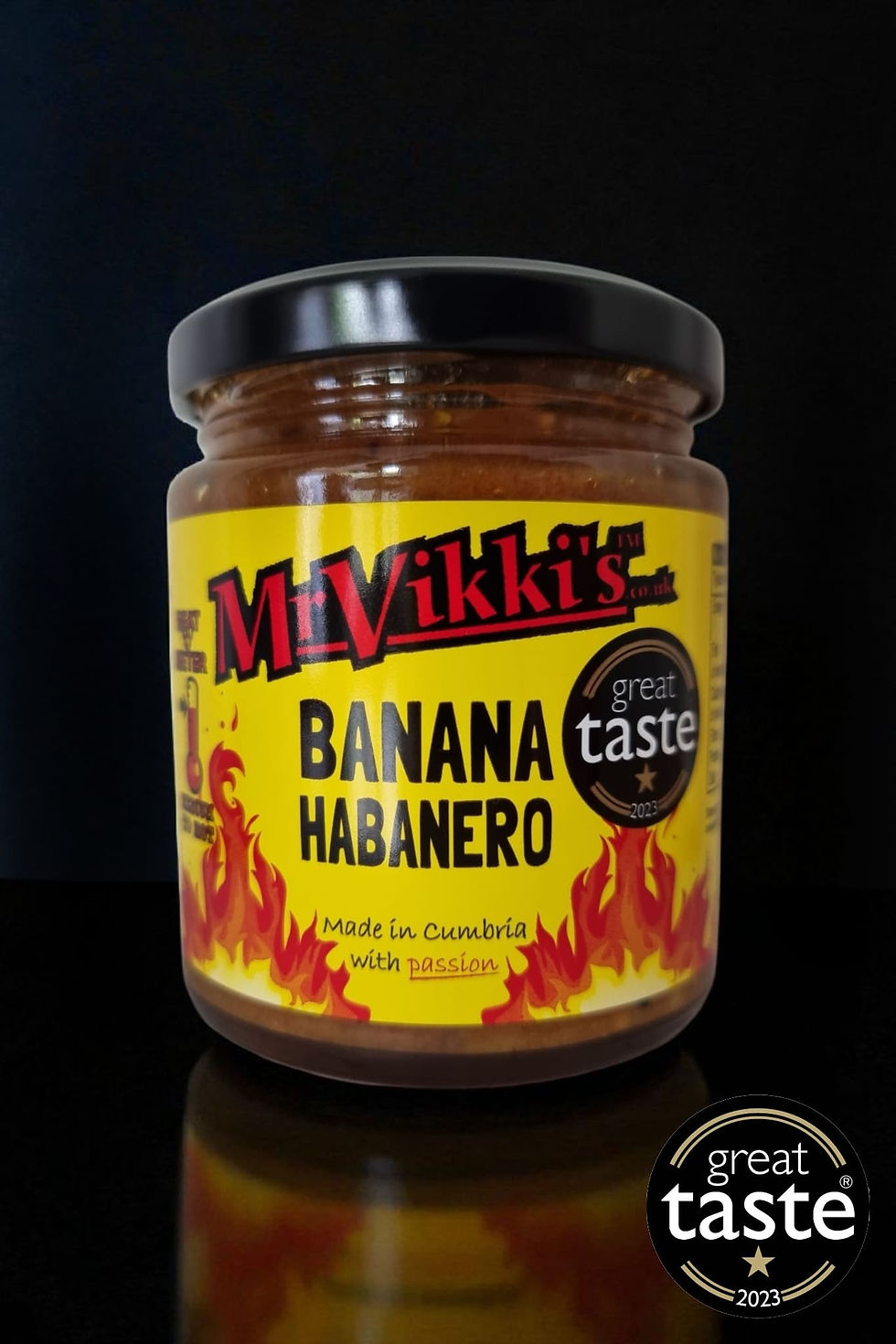 Mr Vikki's Banana Habanero great taste in jar, with a black background.