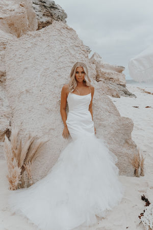 Fishtail satin wedding dress with feathered skirt