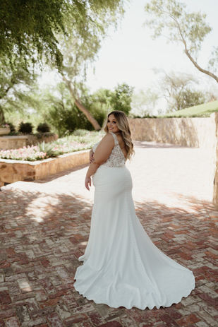 Fitted crepe wedding dress with rouched pleats and floral bodice