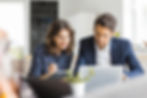 Business owners reviewing different accounting software options for their small business.