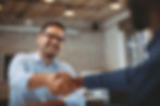 Man shaking the hand of an employer or contractor.