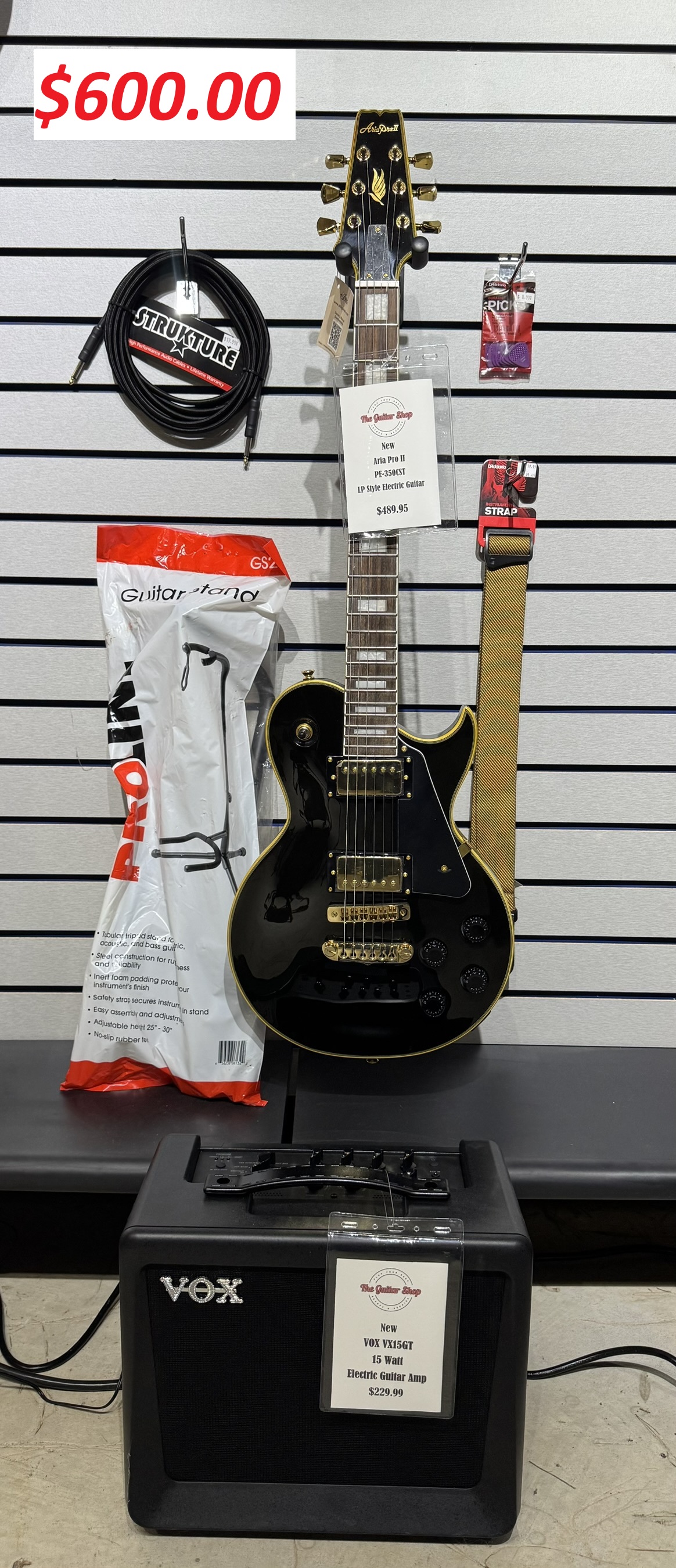 A spread of essential guitar accessories including cables and picks.