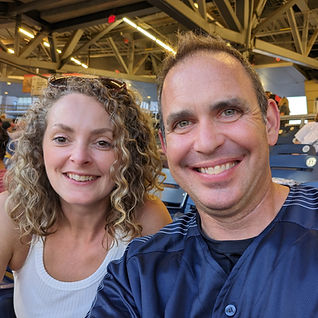 A man and woman smiling